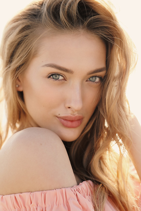 Woman smiling over shoulder